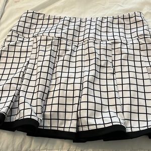 Adorable black and white tennis skirt.